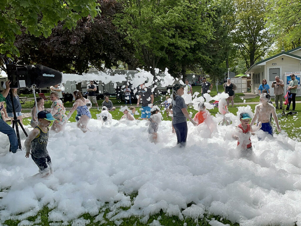 Kids enjoying the foam party blaster