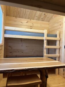 Deluxe cabin , table and twin size bunkbeds