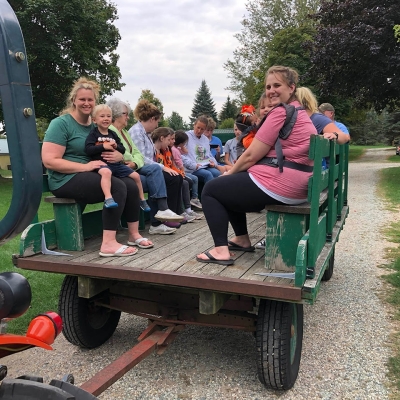 Campers enjoying a ride on the Hay Wagon