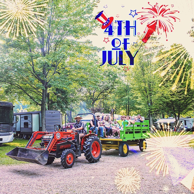 Green hay wagon full of people being pulled by an orange tractor in a campground. Text at top reads 4th of july, with little sparkles/fireworks all over the image.